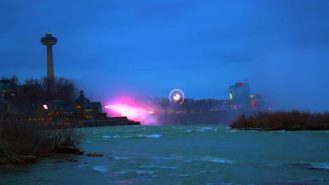 Niagara-Falls,-Canada-Overcast-Evening-Skyline,-Ferris-Wheel-and-vibrant-lights