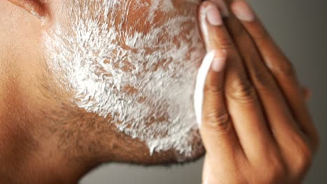 man applying shaving cream