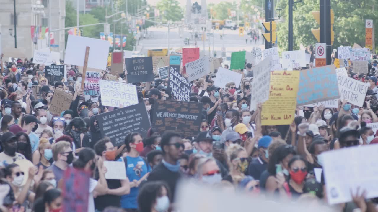 Stunning panning shot of a huge crowd of protesters at a BLM rally