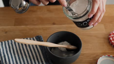 unrecognizable person making cleaning product from ecological ingredients.