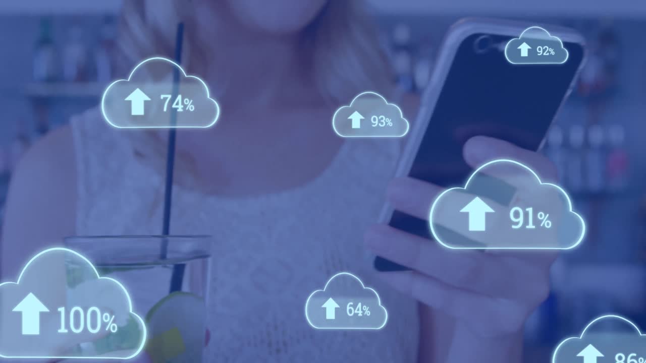 Animation of cloud icons with growing numbers over caucasian woman using smartphone