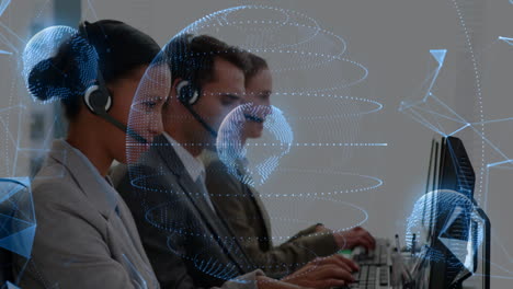 Customer service team working at computers with digital globe animation overlay