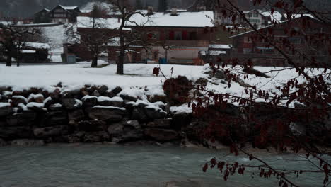 serene view of the weisse lütschine river in lauterbrunnen, switzerland, captured on a tranquil, snowy winter day, showcasing the ethereal beauty of nature