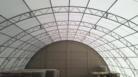 fly through arched roof steel structure construction aerial fly back