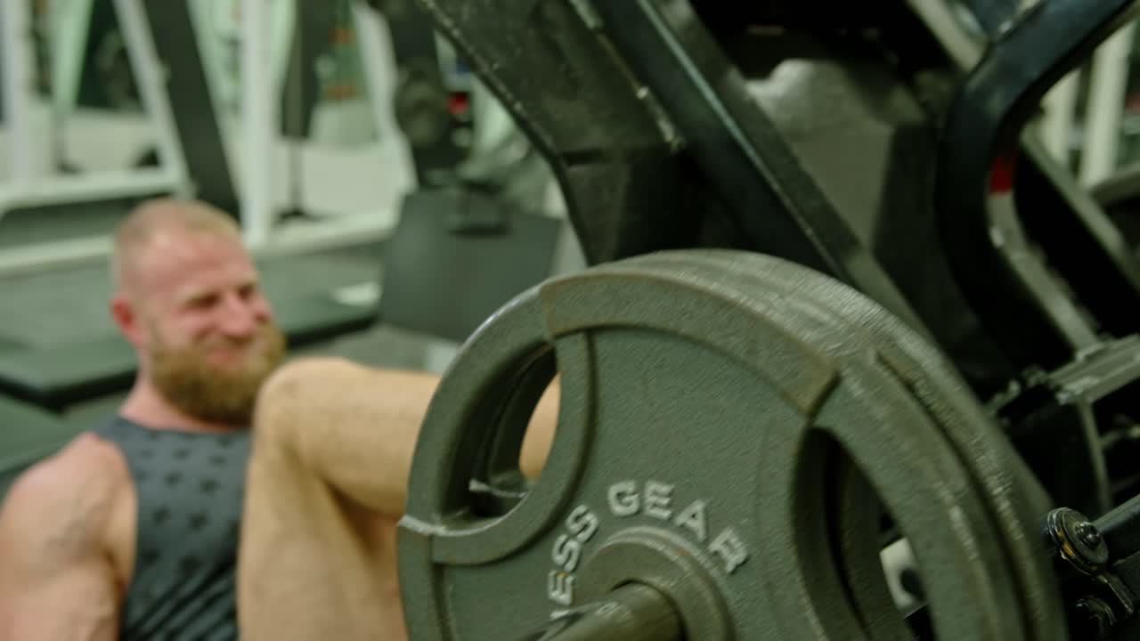 Powerful Man Exercising In Gym