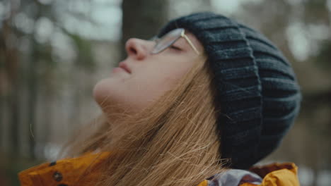 closeup with young woman enjoying the tranquility of forest