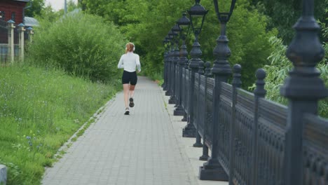woman running on a path