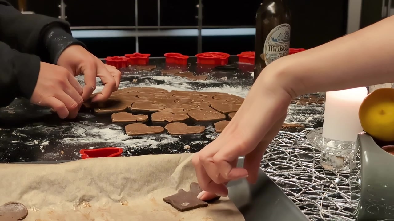 Family making delicious Christmas cookies, side view