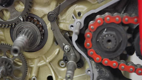 close up of gears of a motorcycle transmission engine under repair