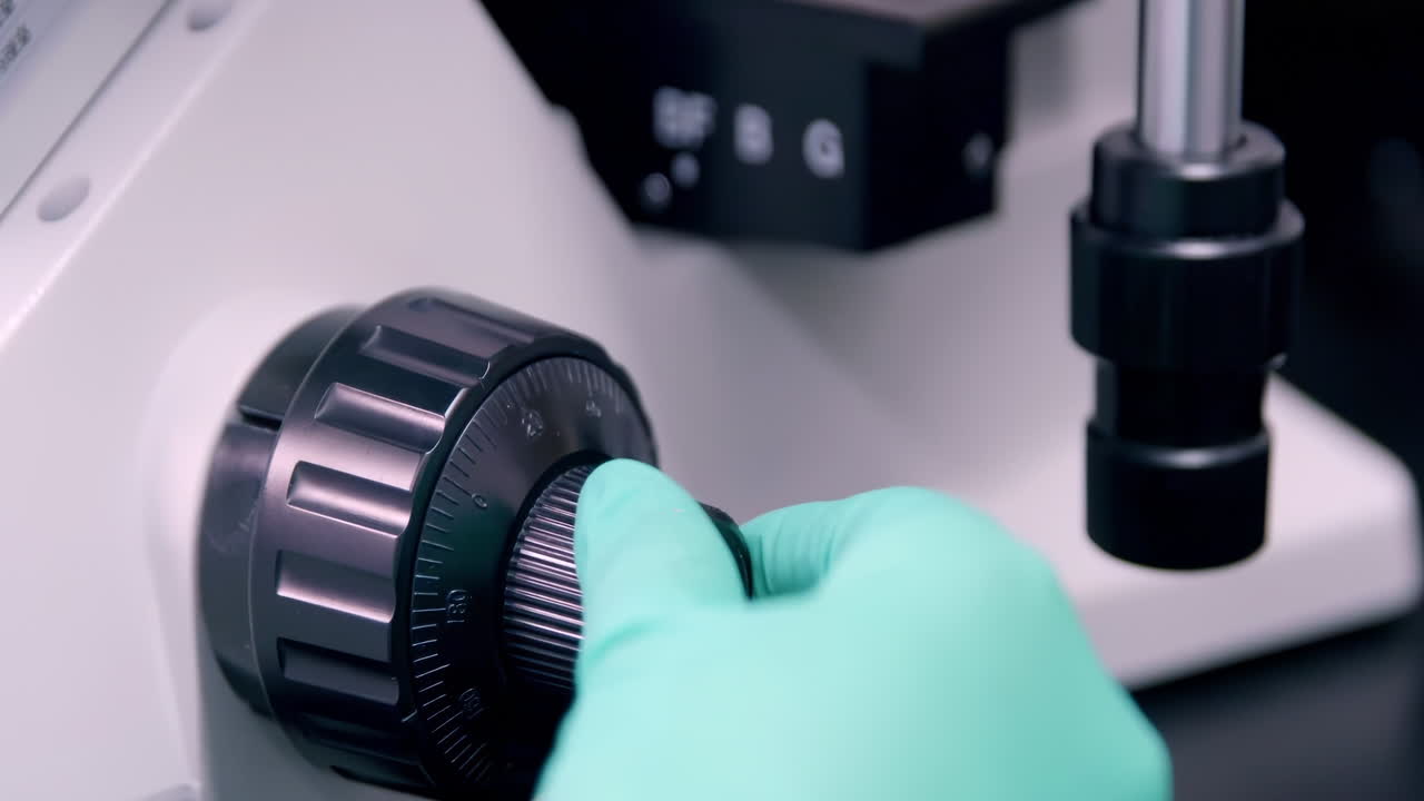 Scientist in lab coats wearing safety gloves performing a biological experiment, and advanced equipment for Analysis