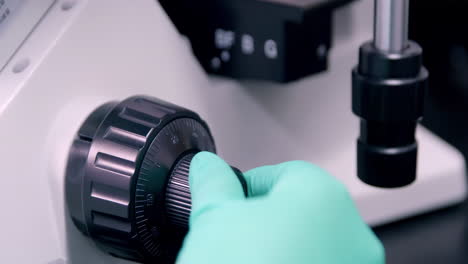 Scientist in lab coats wearing safety gloves performing a biological experiment, and advanced equipment for Analysis