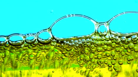 water oil bubbles  behind glass background