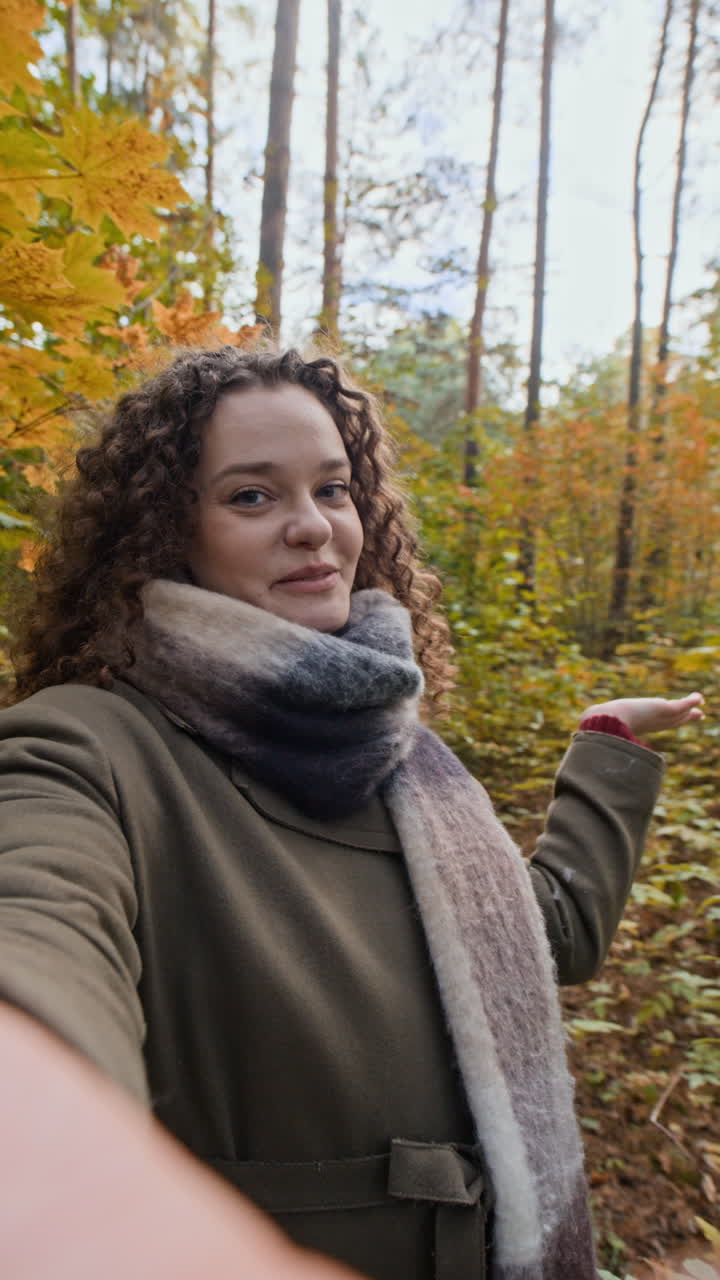 Woman enjoying autumn in the forest