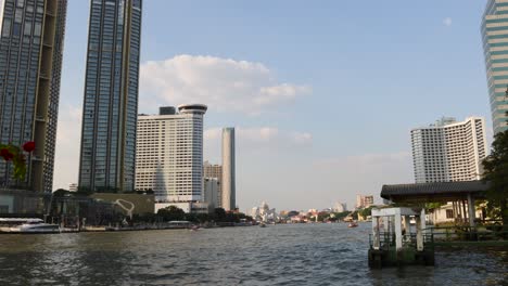 daytime cityscape transformation over a river