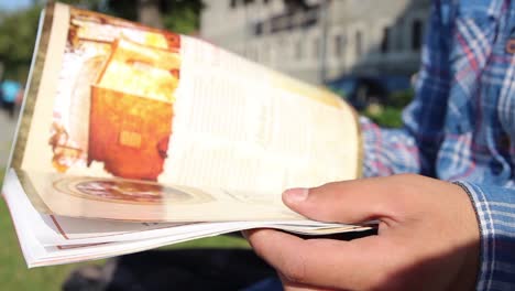 young man reading magazine