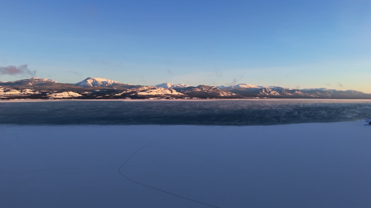 Panoramic View Of Lake Laberge During Winter In Yukon, Canada - Drone Shot