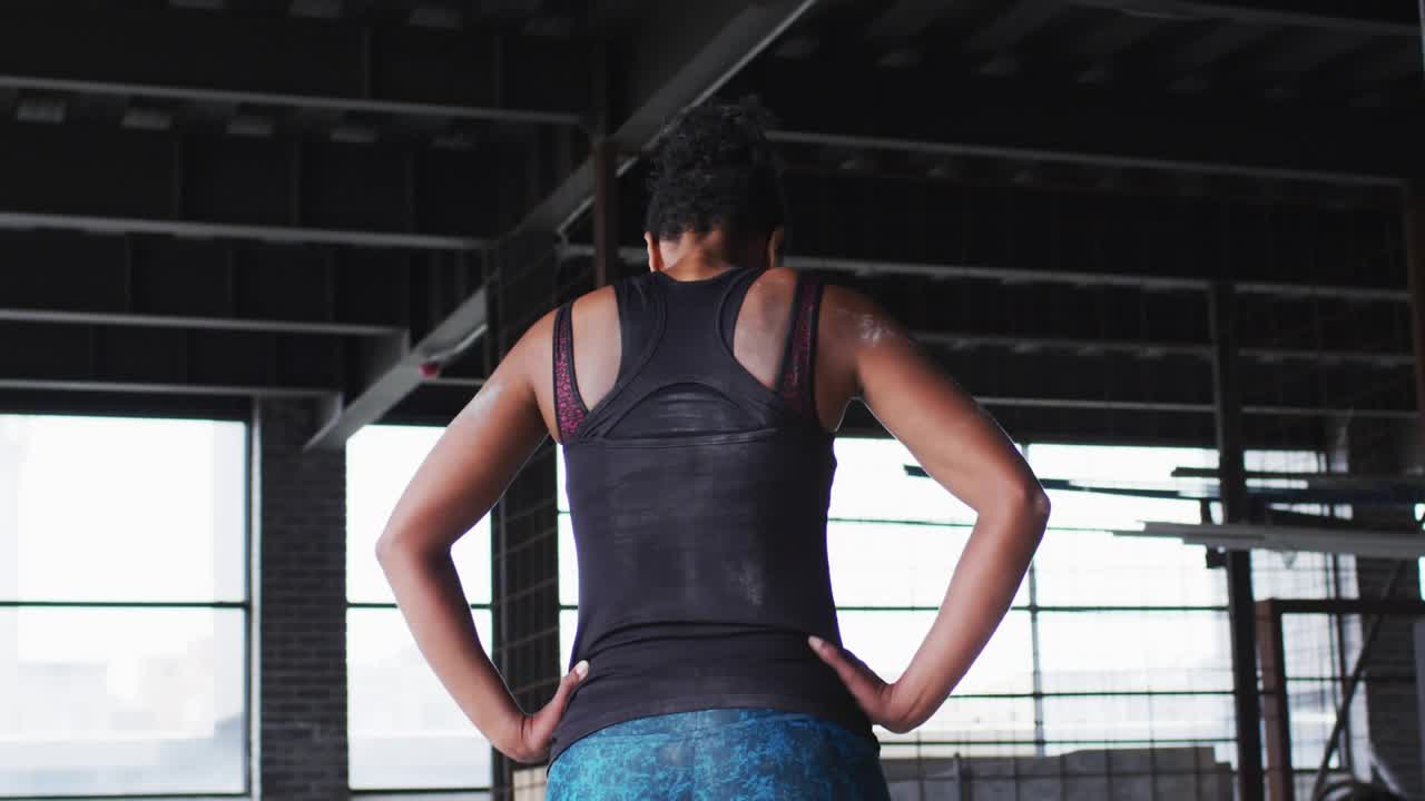Fitness woman standing in gym heart and like icons appearing and growing around her showing likes
