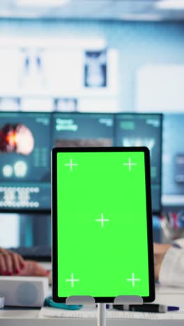 medical consultation with green screen tablet