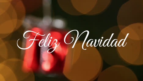 animation of spanish christmas greetings over christmas present