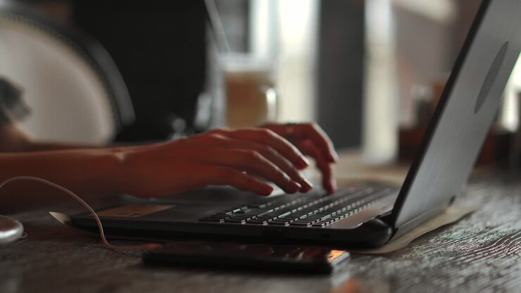 Side profile half-faced photo of busy concentrated smart clever beautiful woman wearing checkered shirt and glasses, she has remote work, typing on laptop and sending emails to clients, soft light