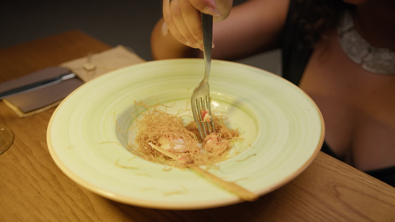 Woman Using The Fork To Eat A Shrimps Gourmet Dish For Dinner