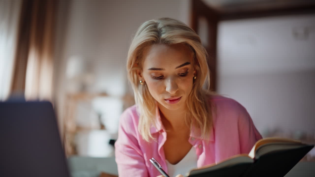 Smart woman studying online looking laptop video lesson at home couch closeup
