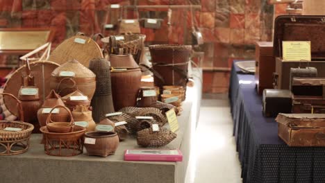 thai north- eastern style handcrafted basketwork museum displaying different sizes and types of handmade baskets and containers