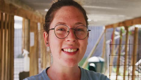 Caucasian-volunteer-woman-in-dog-shelter