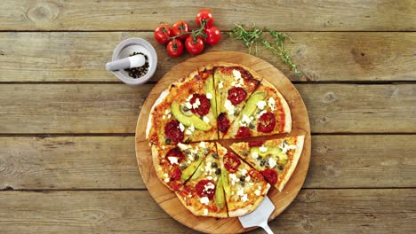 delicious pizza with ingredients on wooden table