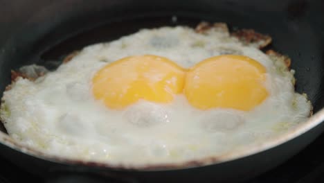 Extreme-Closeup,-Double-Yolker-Egg-with-Two-Yolks-Frying-in-Pan