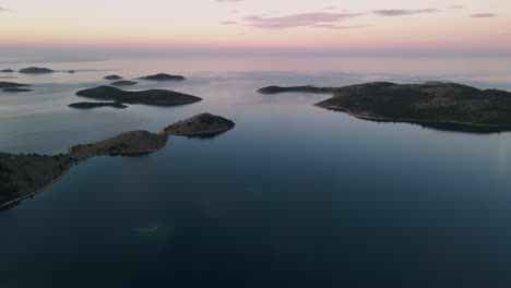 beautiful sunset over tranquil sea water, paradisiac kornati archipelago, national park kornati