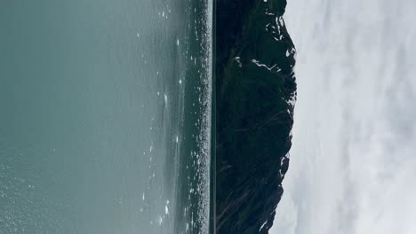 ice floating near the coastline by hubbard glacier, alaska - vertical orientation