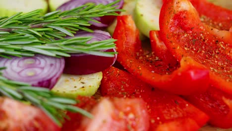 colorful seasoned vegetables on rustic wood with herbs, salt, and bright natural lighting, slow motion