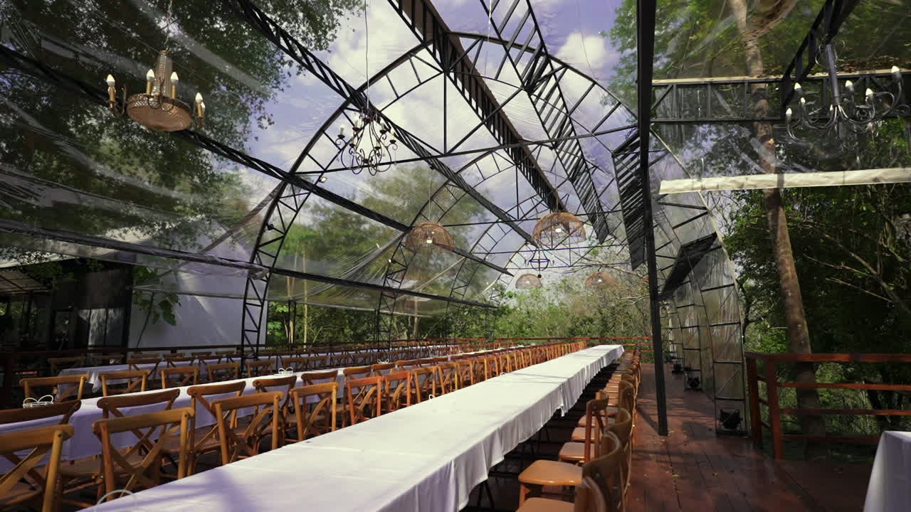 Modern jungle pavilion with transparent roof and banquet setup for luxury destination weddings, Parana, Iguazu, Argentina
