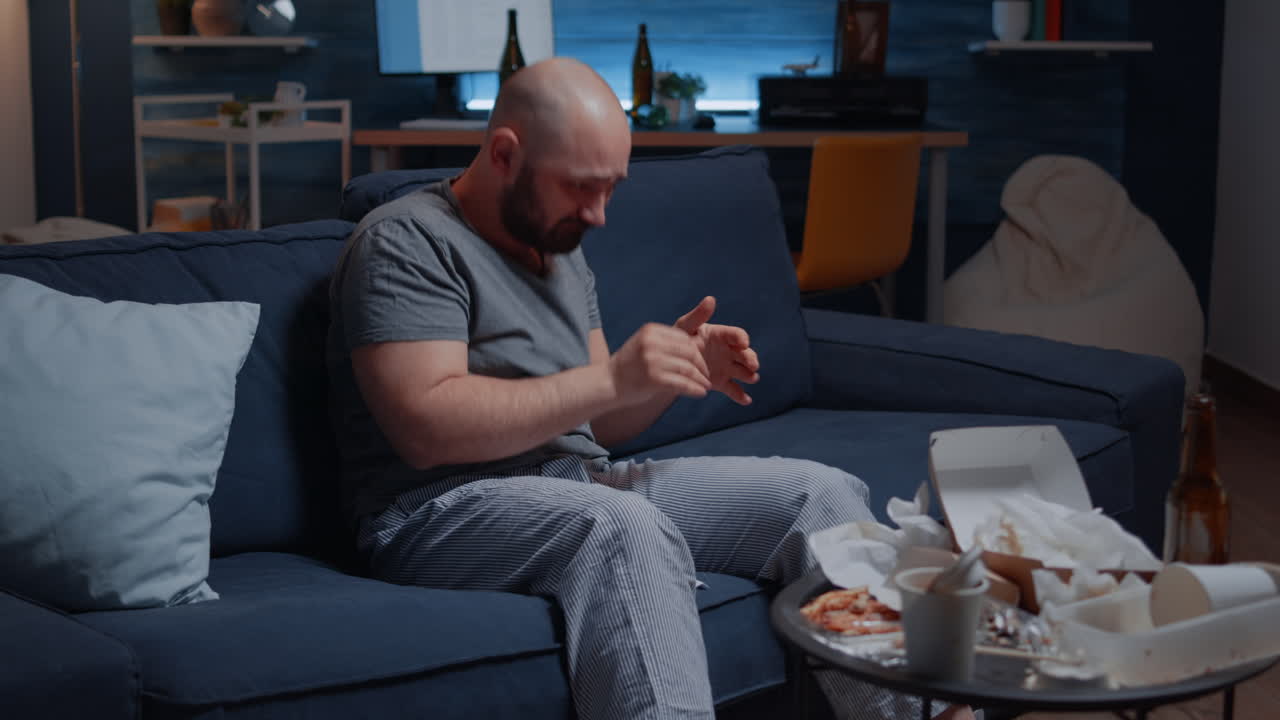 Frustrated nevous man breaking letter, debt notification