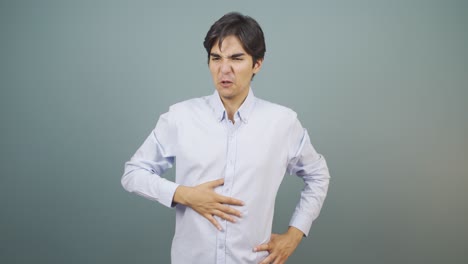 man experiencing stomachache.