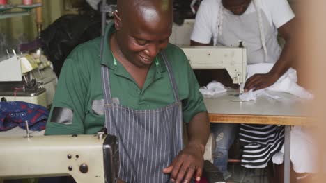 African-man-cutting-tissue