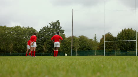 rugby player taking a kick and scoring