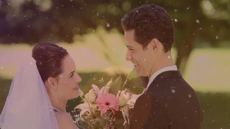 animation of light spots over happy caucasian married couple showing ring