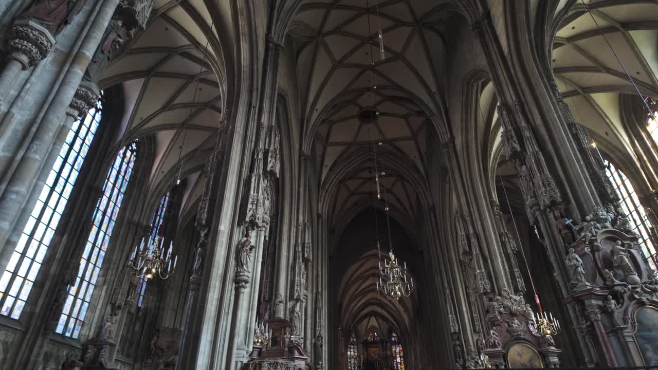 Interior of St. Stephen's Cathedral in Vienna, Austria, showcasing gothic architecture and tall arches