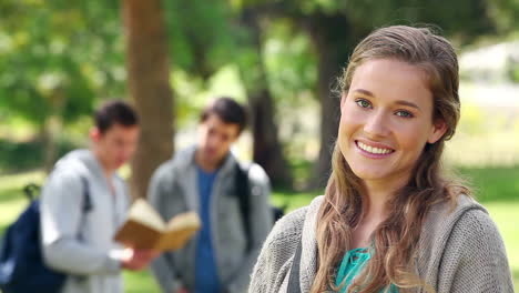 Woman-smiling-while-looking-to-the-side-before-turning-to-look-at-the-camera