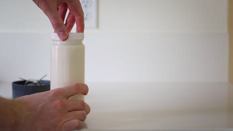 making homemade plastic free almond milk- male