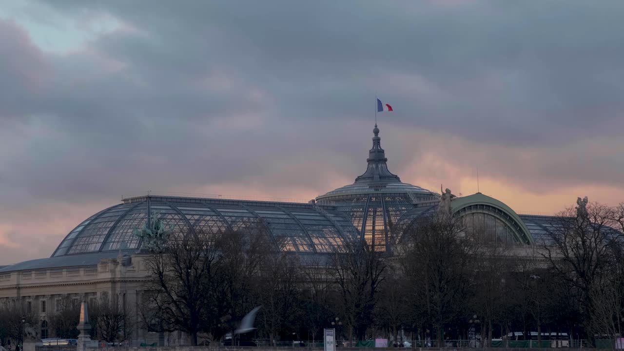 Cloudy sunset sky over the Grand Palais in Paris
