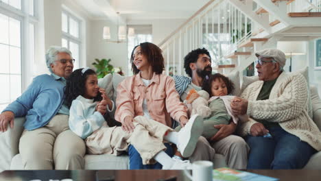 a happy multigenerational family enjoying time together in their living room