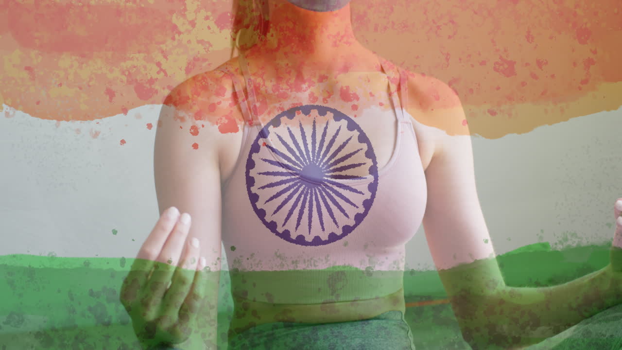 Animation of woman wearing face mask practicing yoga over indian flag