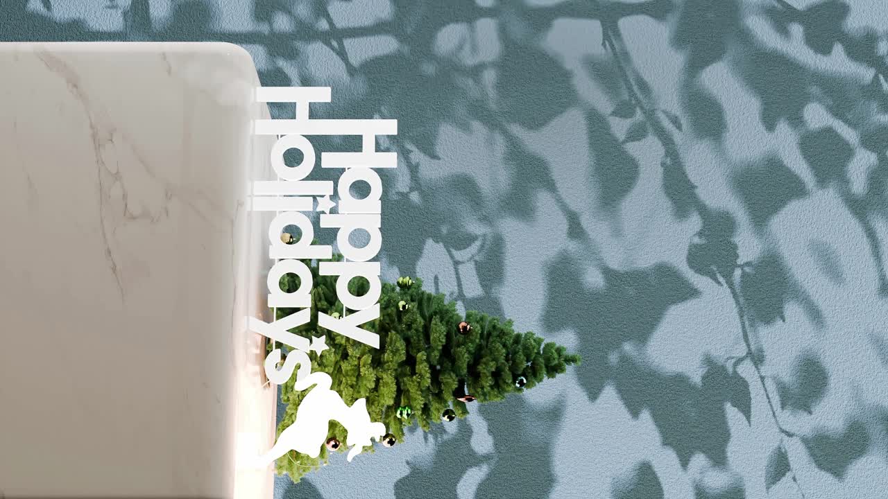 파란색 꽃 그림자 배경으로 대리석 플랫폼에 "행복한 휴일"을 표시 한 작은 크리스마스 트리