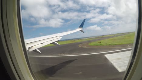 airplane taking off from tropical island