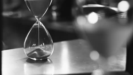 close up hourglass on table