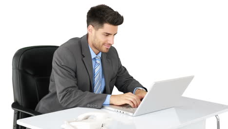 Young-businessman-working-at-his-desk