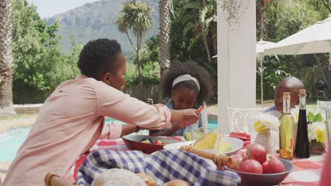 happy family eating together at table